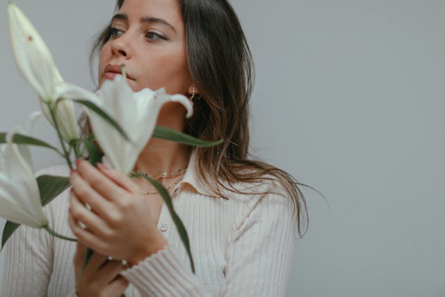 A woman smelling flowers